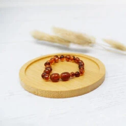 Bracelet D'Ambre Bébé Cognac IRREVERSIBLE BIJOUX -Bébés Produits Magasin IRREVERSIBLE BB 1 1COGNS1
